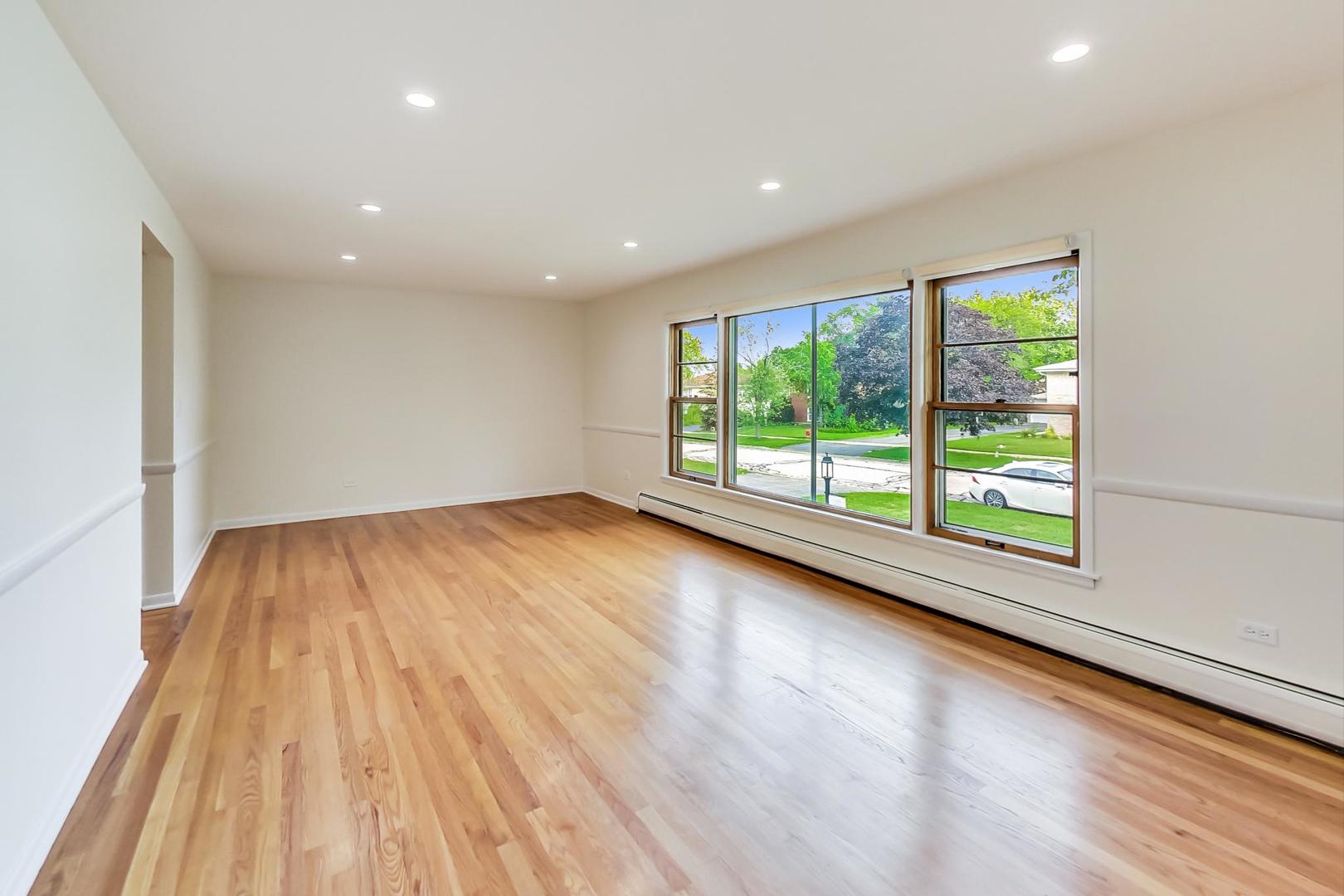 16W674 56th Place Clarendon Hills, IL 60514 - Photo 4 of 41 a view of room with window and wooden floor