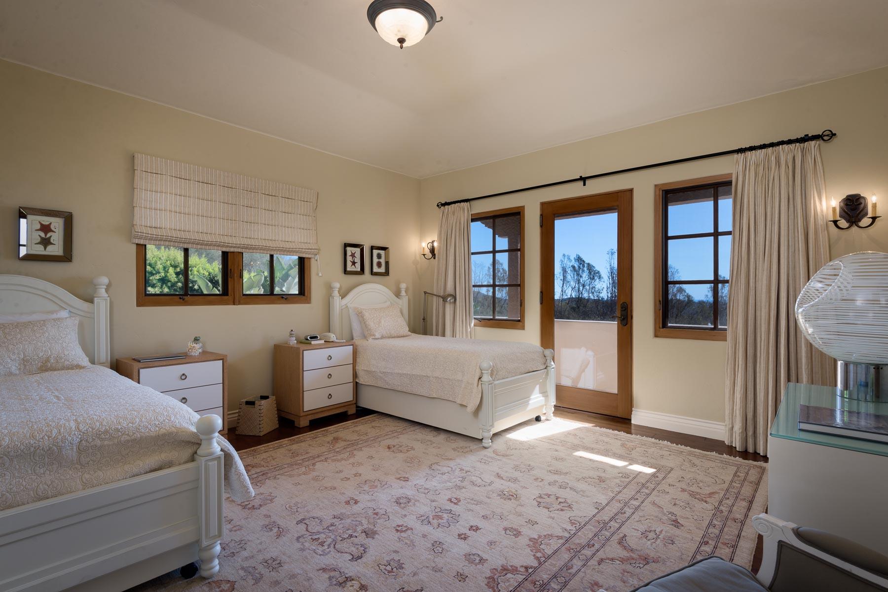 2220 Bella Vista Drive Montecito, CA 93108 - Photo 12 of 27 a spacious bedroom with two beds and large window
