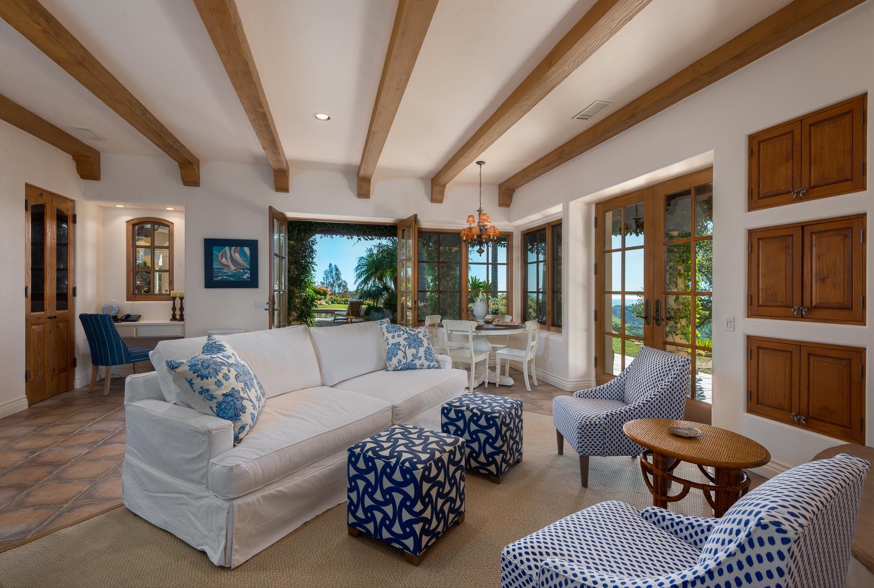 2220 Bella Vista Drive Montecito, CA 93108 - Photo 15 of 27 a living room with furniture a rug and a chandelier