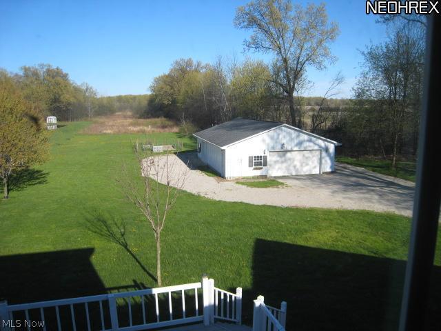 3116 State Road, Unit 60 Vermilion, OH 44089 - Photo 13 of 17 View of back yard and 23 x 40 outbuilding with overhead doors and electric