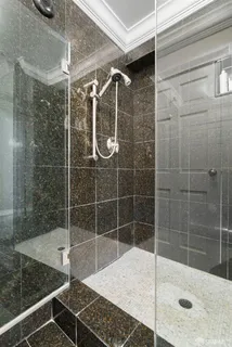 a bathroom with a shower and a sink