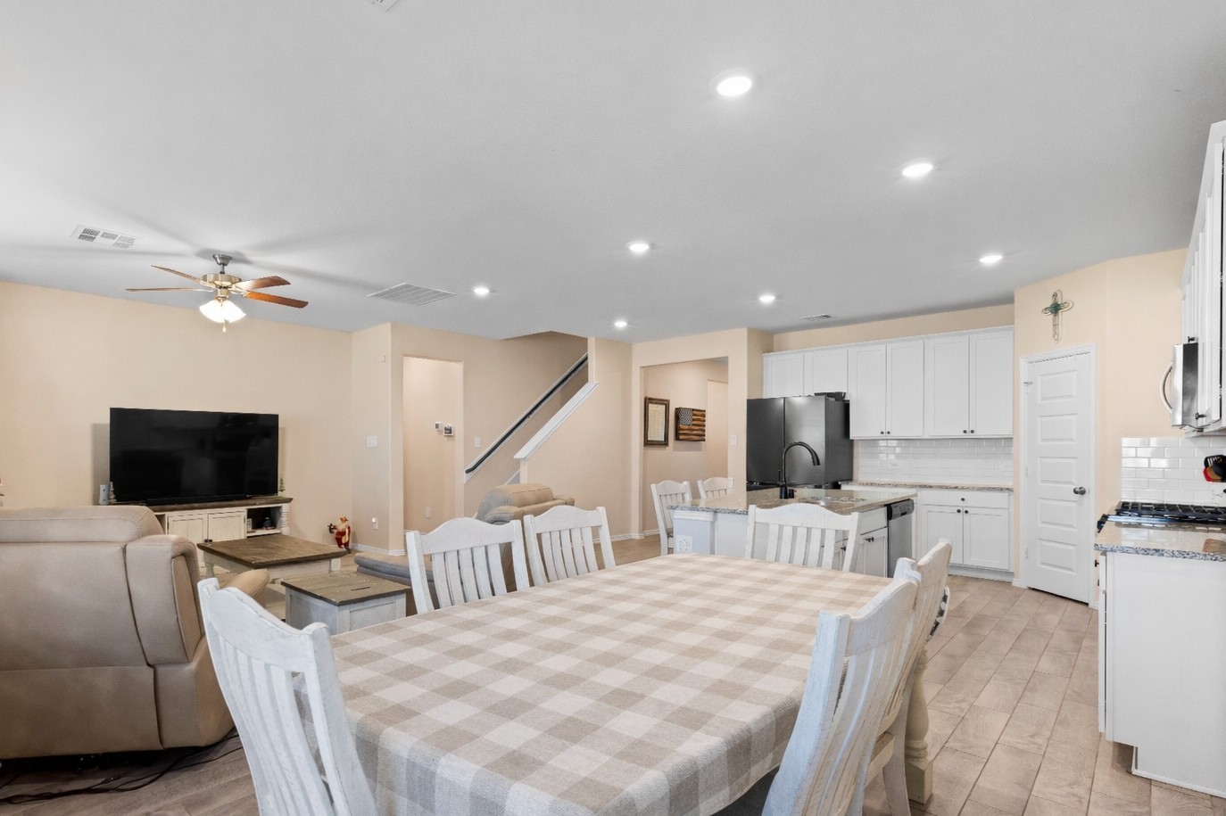 14499 Sunny Bend Way Conroe, TX 77303 - Photo 13 of 41 a large kitchen with a table and chairs