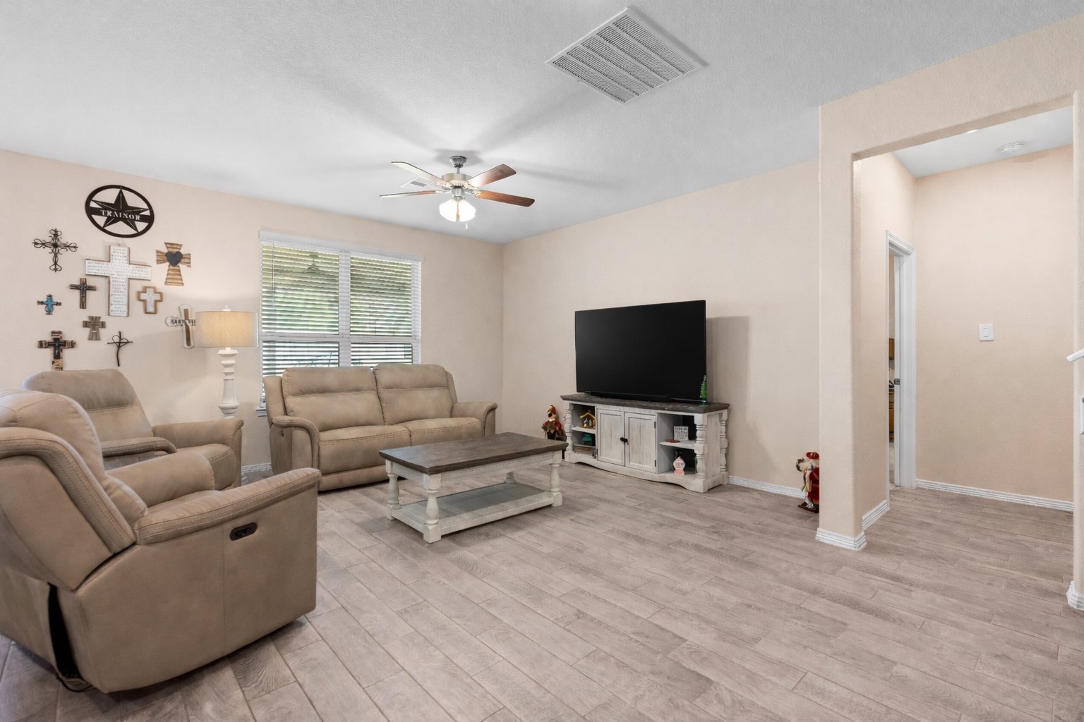 14499 Sunny Bend Way Conroe, TX 77303 - Photo 14 of 41 a living room with furniture and a flat screen tv
