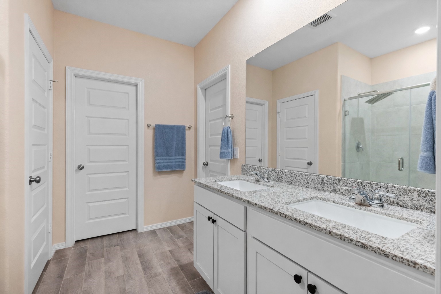 14499 Sunny Bend Way Conroe, TX 77303 - Photo 17 of 41 a bathroom with a granite countertop sink and mirror