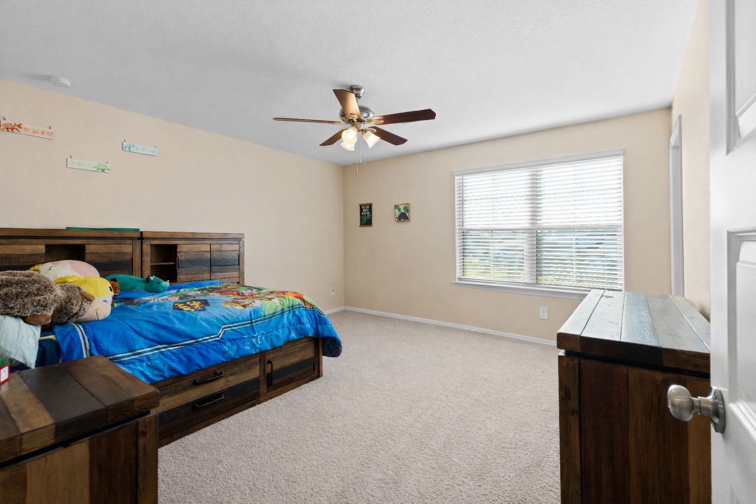 14499 Sunny Bend Way Conroe, TX 77303 - Photo 21 of 41 a bed sitting in a bedroom next to a window