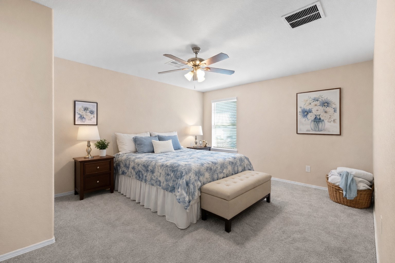 14499 Sunny Bend Way Conroe, TX 77303 - Photo 25 of 41 a spacious bedroom with a bed and a chandelier