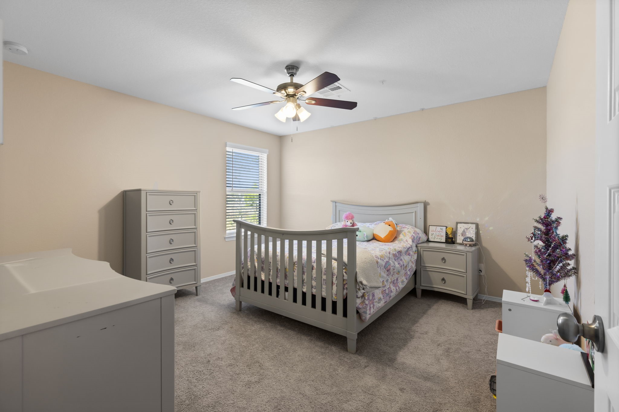 14499 Sunny Bend Way Conroe, TX 77303 - Photo 26 of 41 a bedroom with furniture and a chandelier