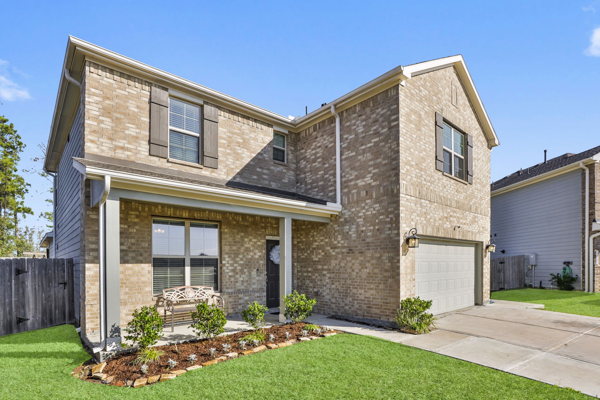 14499 Sunny Bend Way Conroe, TX 77303 - Photo 3 of 41 a front view of a house with garden