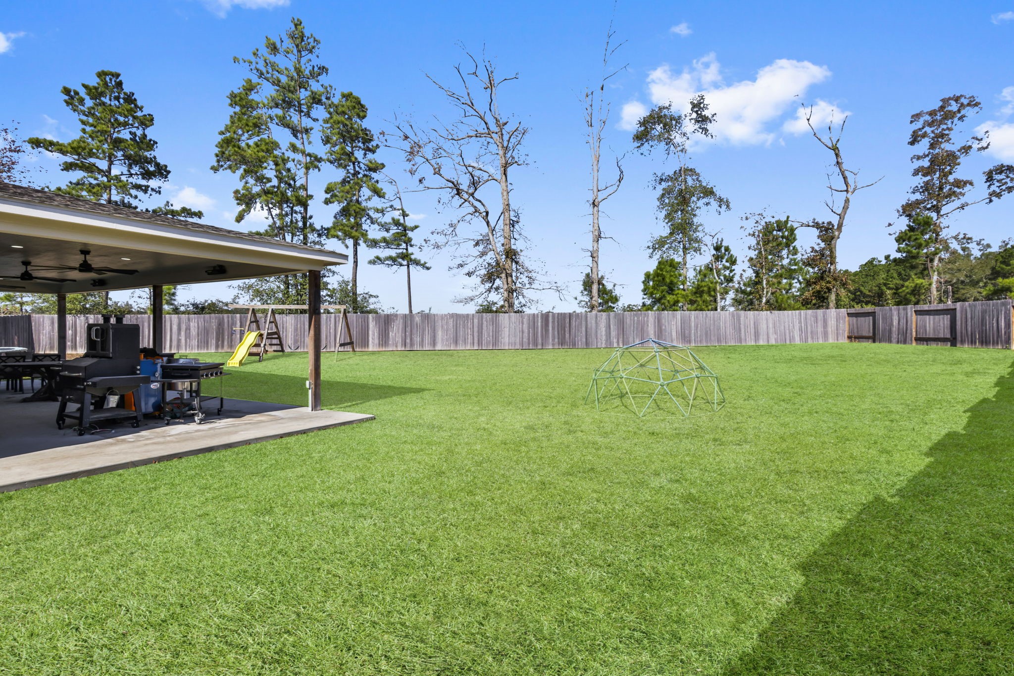 14499 Sunny Bend Way Conroe, TX 77303 - Photo 32 of 41 a view of a house with a yard