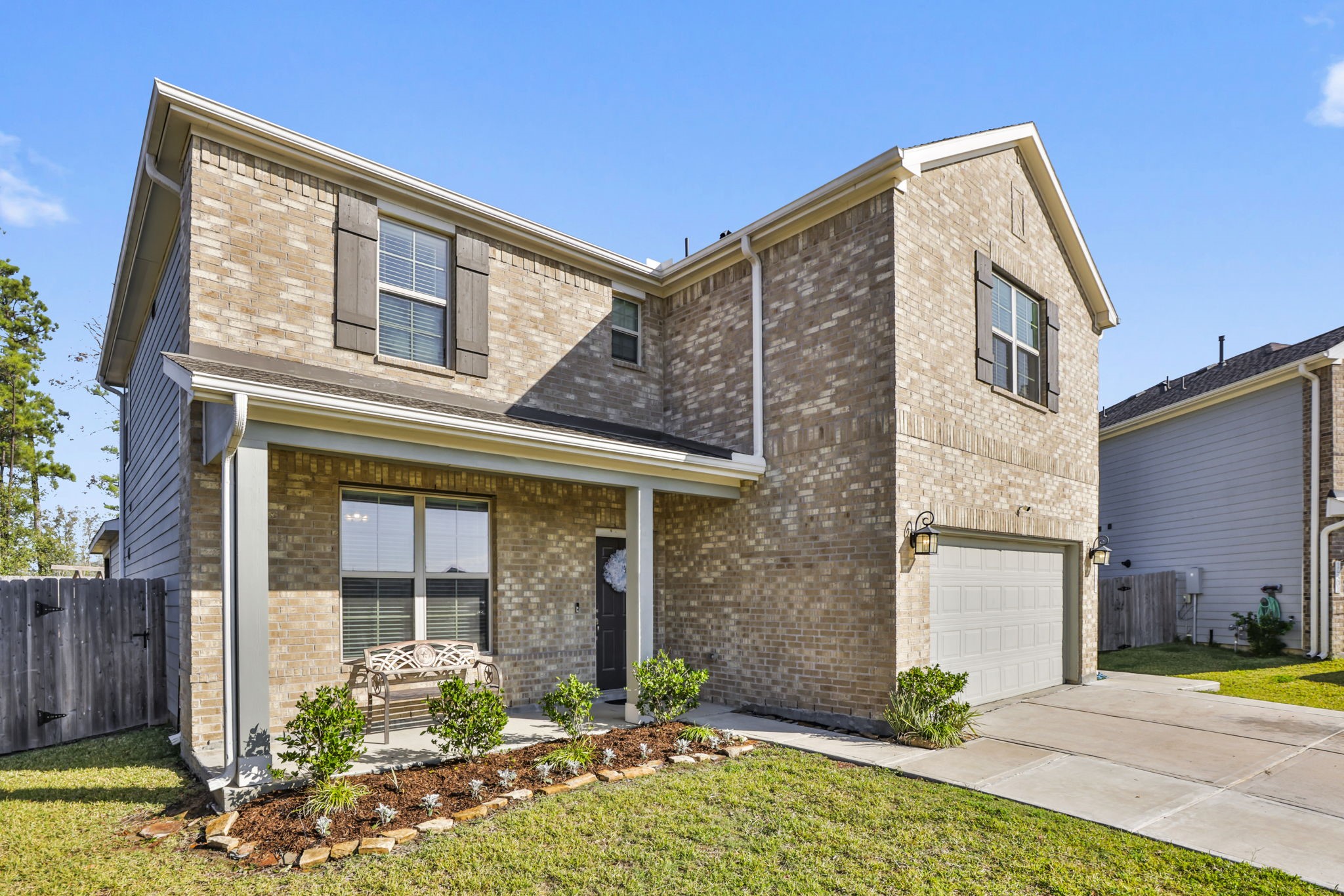14499 Sunny Bend Way Conroe, TX 77303 - Photo 33 of 41 a front view of a house with garden