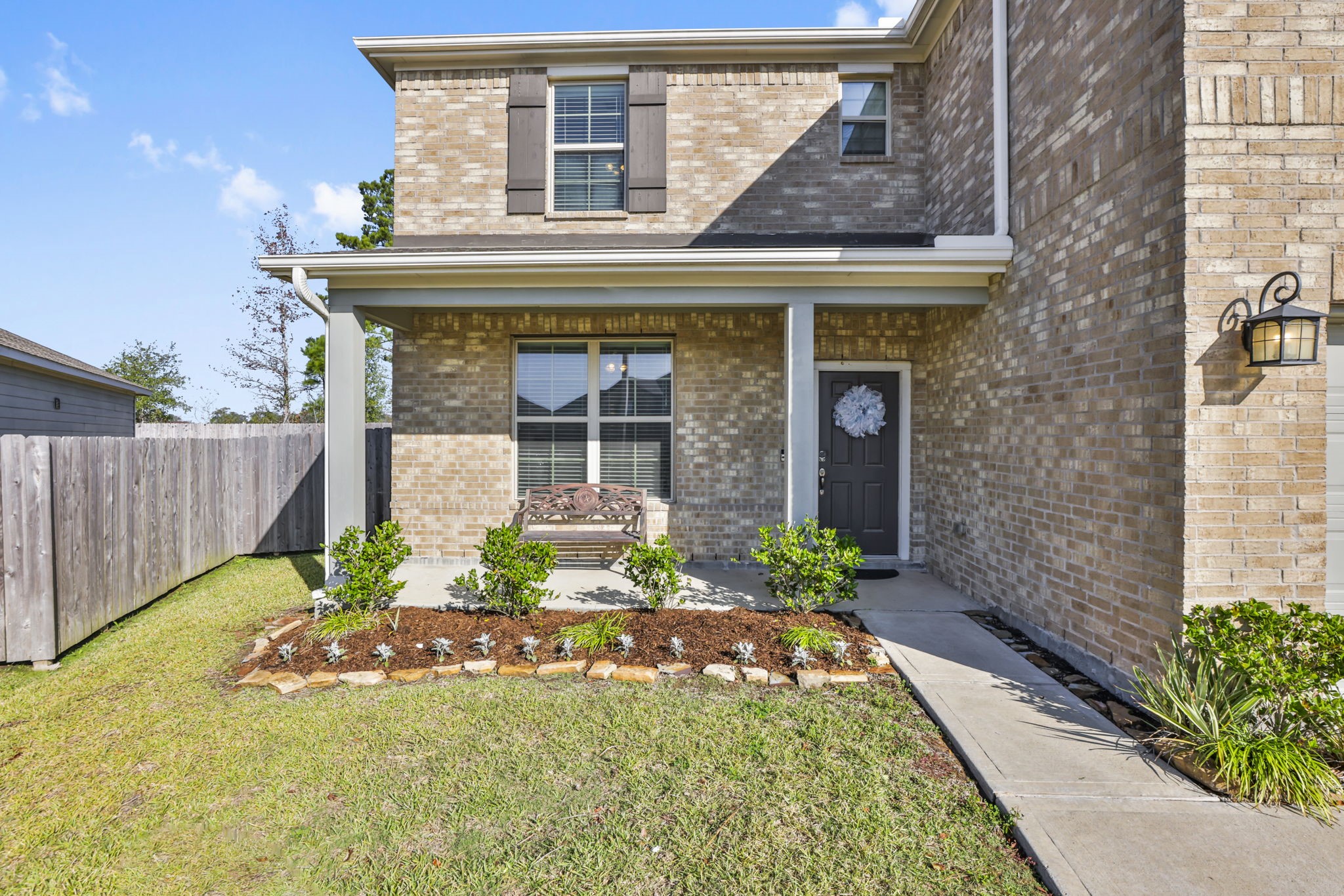 14499 Sunny Bend Way Conroe, TX 77303 - Photo 34 of 41 a front view of a house with garden