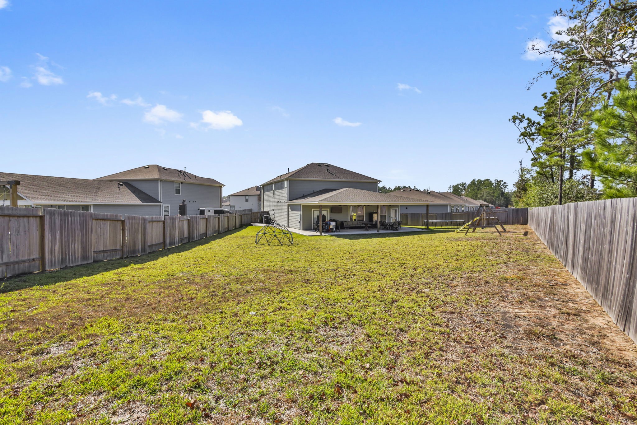 14499 Sunny Bend Way Conroe, TX 77303 - Photo 35 of 41 a view of a house with a swimming pool