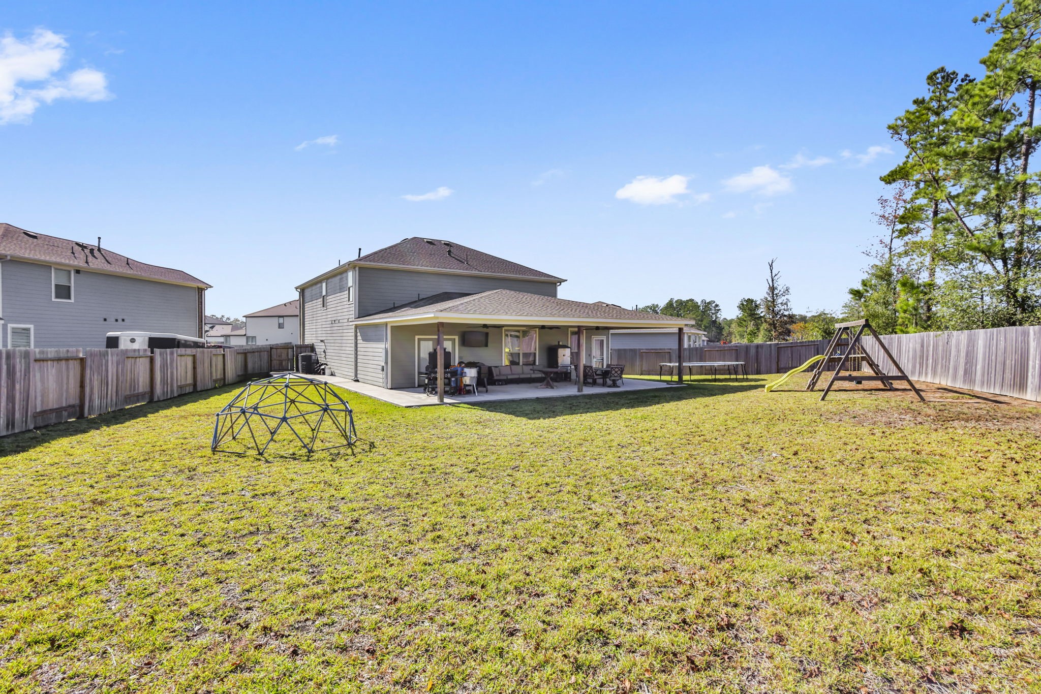 14499 Sunny Bend Way Conroe, TX 77303 - Photo 36 of 41 a swimming pool with outdoor seating and yard