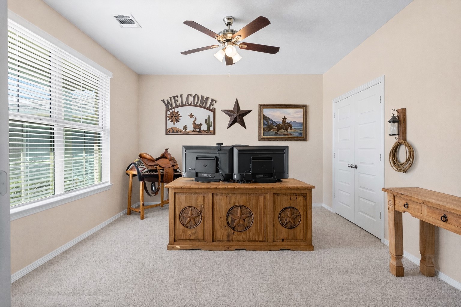 14499 Sunny Bend Way Conroe, TX 77303 - Photo 6 of 41 a living room with furniture a window and a clock