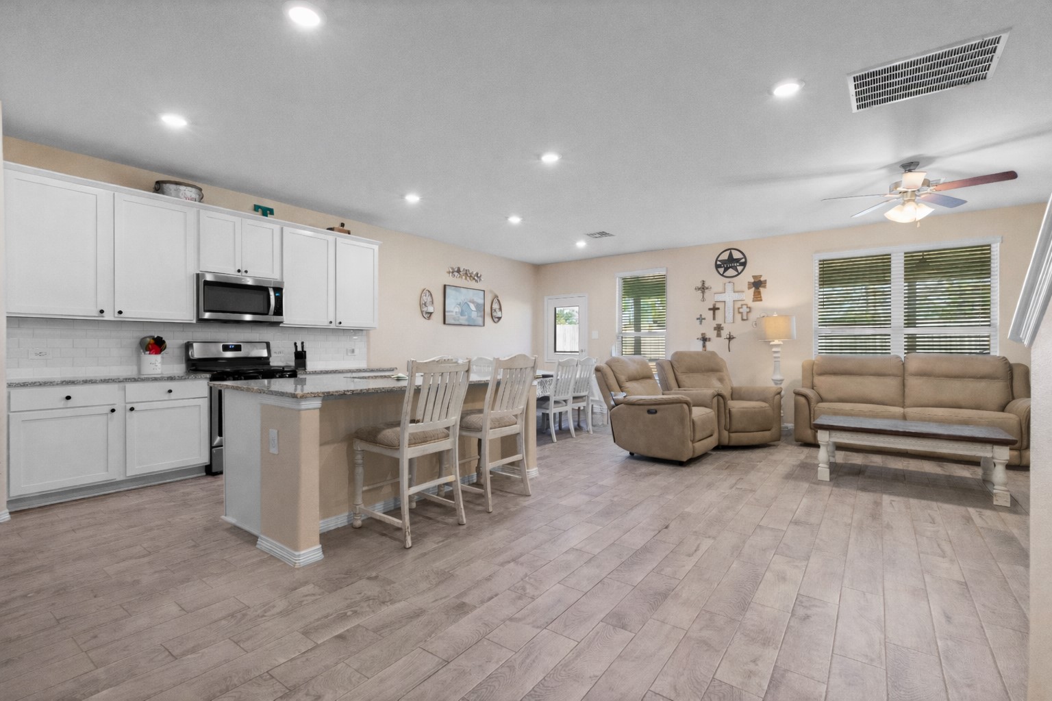 14499 Sunny Bend Way Conroe, TX 77303 - Photo 10 of 41 a kitchen with white cabinets and window