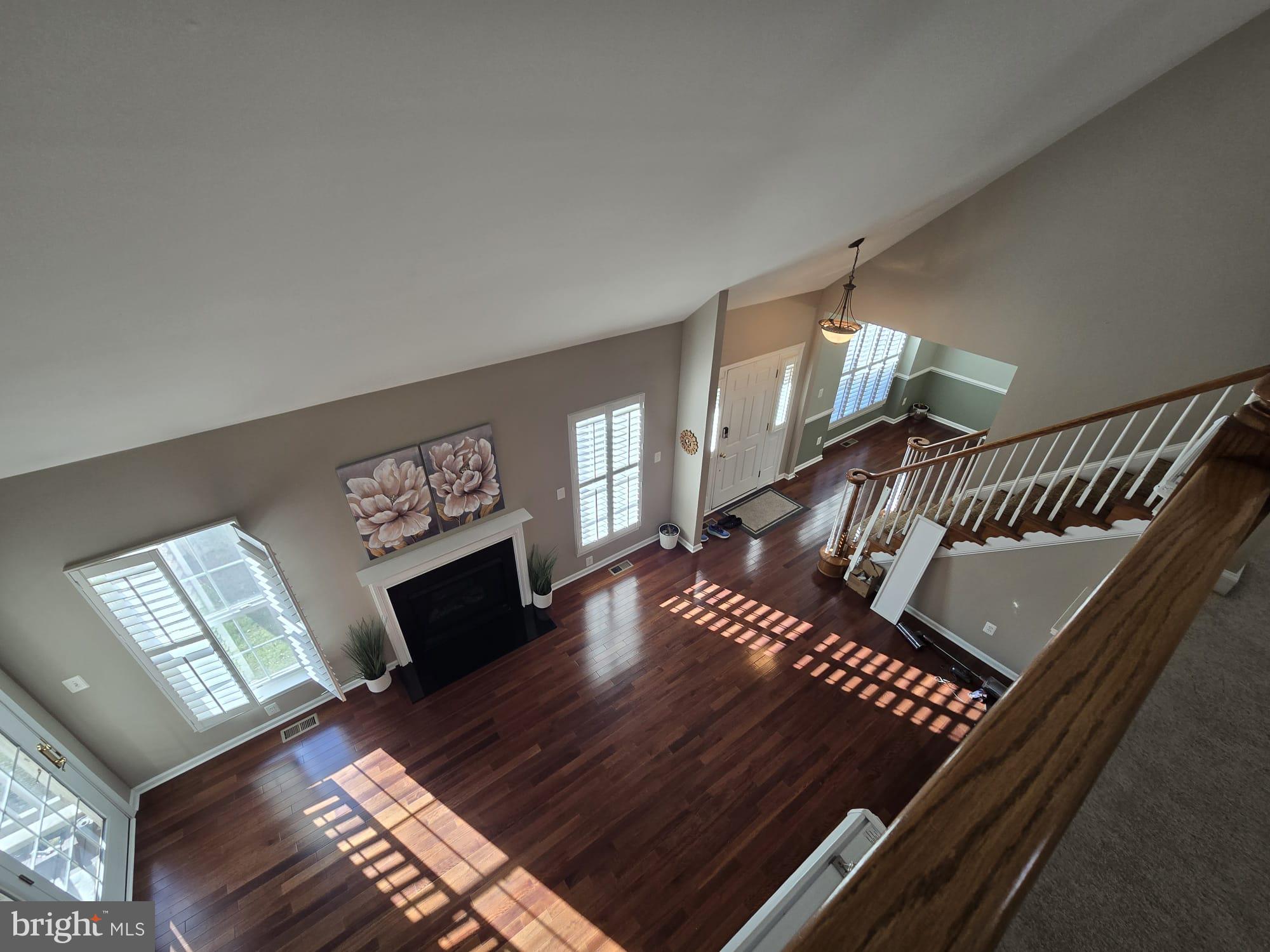 25170 Fortitude Terrace Chantilly, VA 20152 - Photo 26 of 50 a living room with furniture and a fireplace