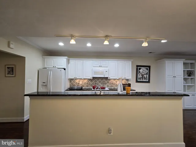 a view of a kitchen with cabinets