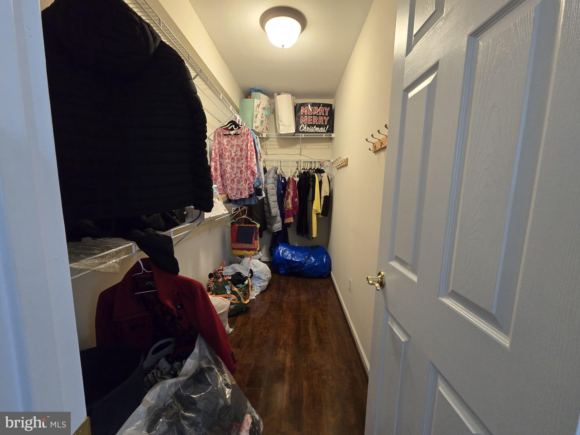 25170 Fortitude Terrace Chantilly, VA 20152 - Photo 46 of 50 a view of walk in closet with clothes