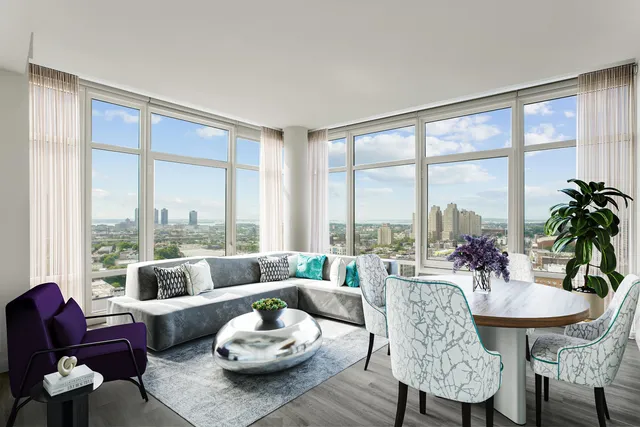 a living room with furniture and a large window