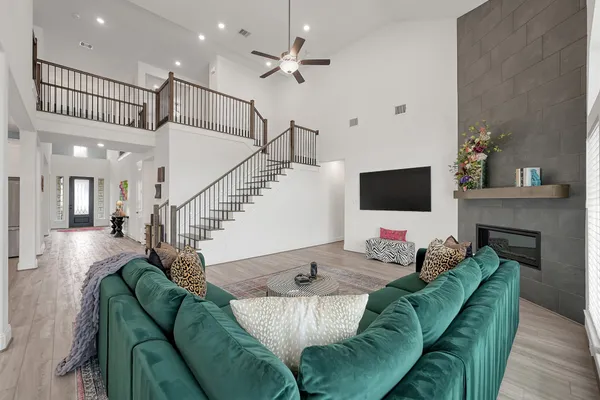 a living room with furniture and a flat screen tv