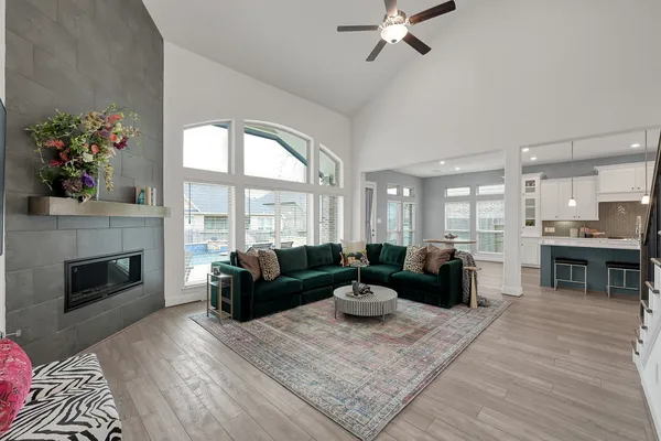 a living room with furniture fireplace and window