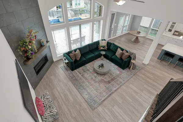 a living room with furniture and a fireplace
