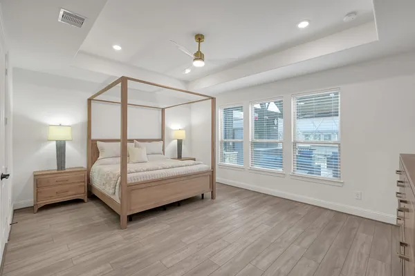 a bedroom with a large bed and a window