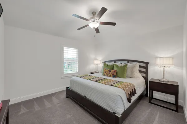 a bedroom with a bed and window