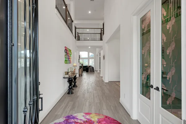 a hallway with a wooden floor and entryway
