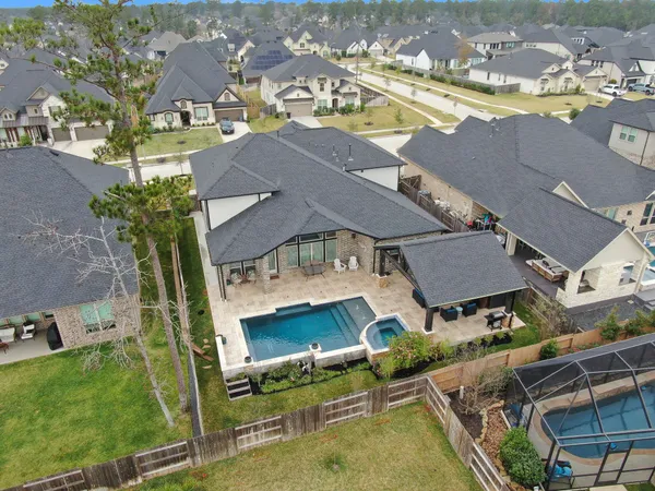 an aerial view of a house with a ocean view