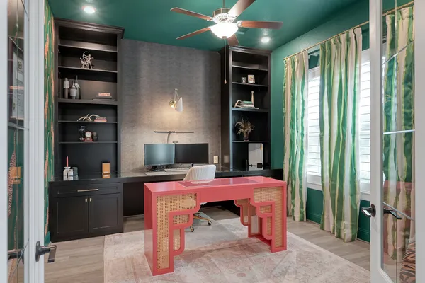 a room with furniture and book shelf