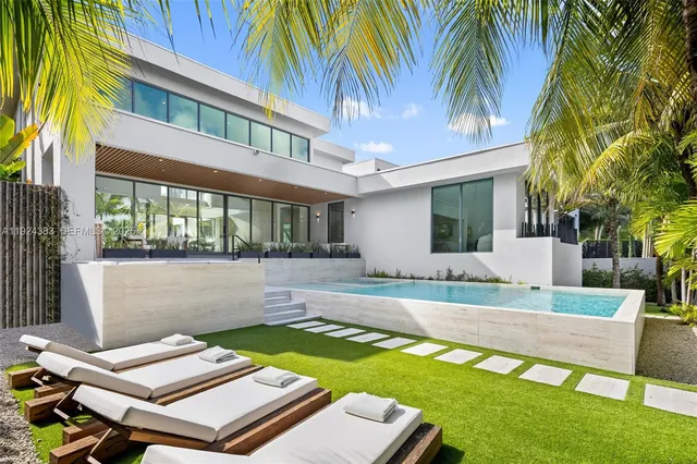 a view of multiple houses with a street