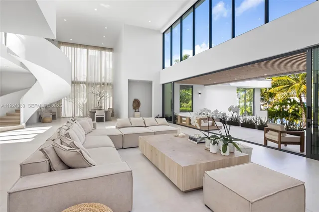 a spacious bedroom with a large bed and a flat screen tv