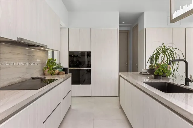 a bathroom with a sink double vanity and a mirror