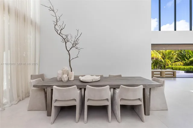 a bedroom with a large bed and a large window