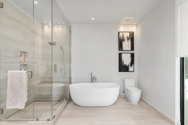 a park with water view and a yard