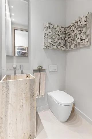 a aerial view of a house with a yard and potted plants