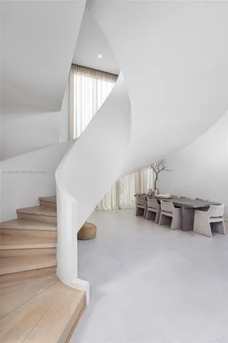 an aerial view of residential houses with outdoor space and swimming pool