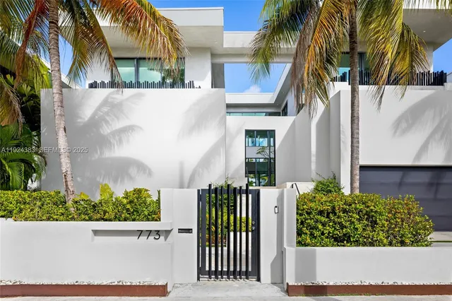 a living room with fireplace furniture and a large window