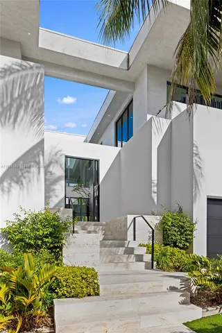 a living room with furniture a lamp and a large window