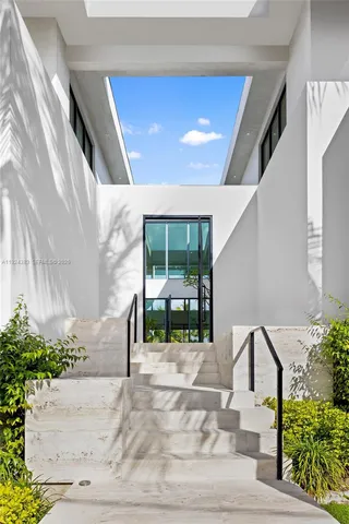 a building outdoor space with patio furniture and potted plants