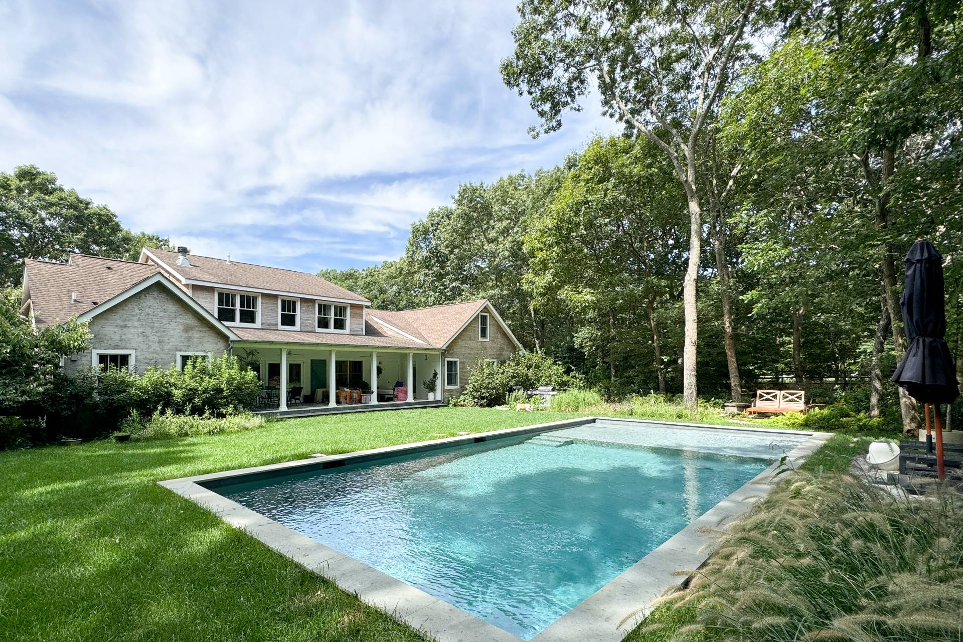 569 Toppings Path Sagaponack, NY 11962 - Photo 1 of 30 front view of a house with a yard
