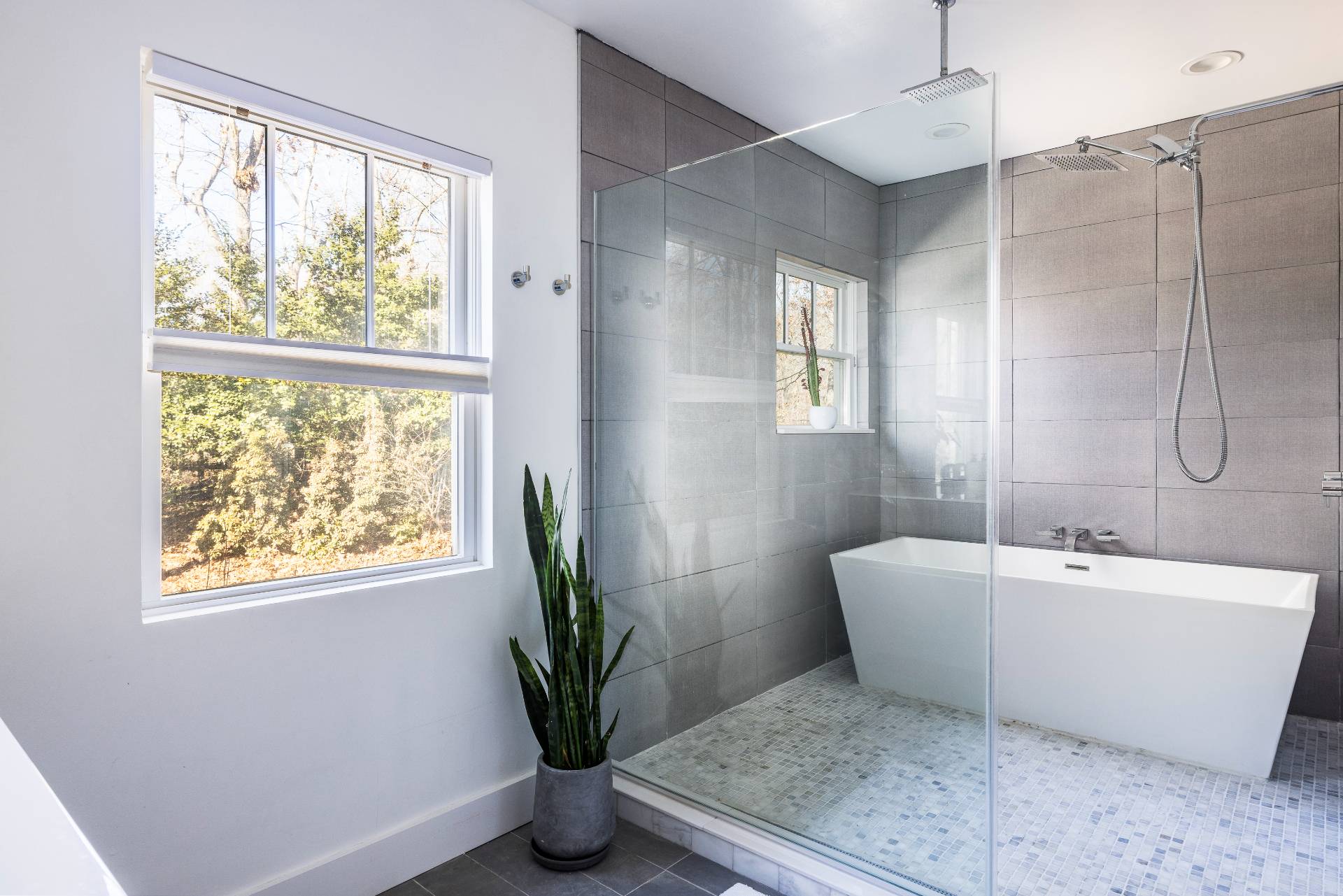 569 Toppings Path Sagaponack, NY 11962 - Photo 11 of 30 a white bath tub sitting in a bathroom next to a window