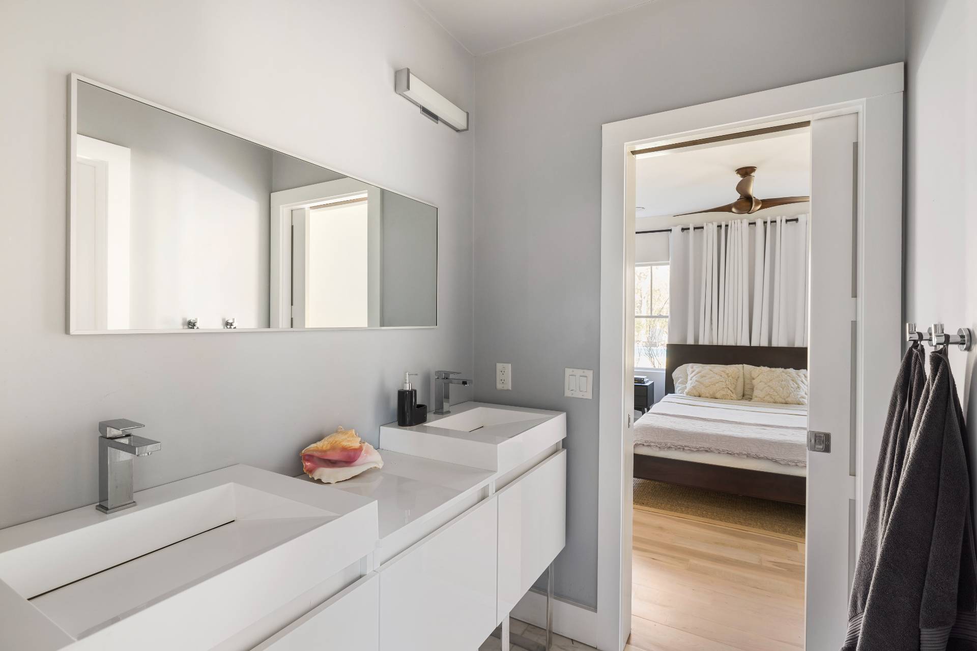 569 Toppings Path Sagaponack, NY 11962 - Photo 21 of 30 a en suite bathroom with a sink and a window