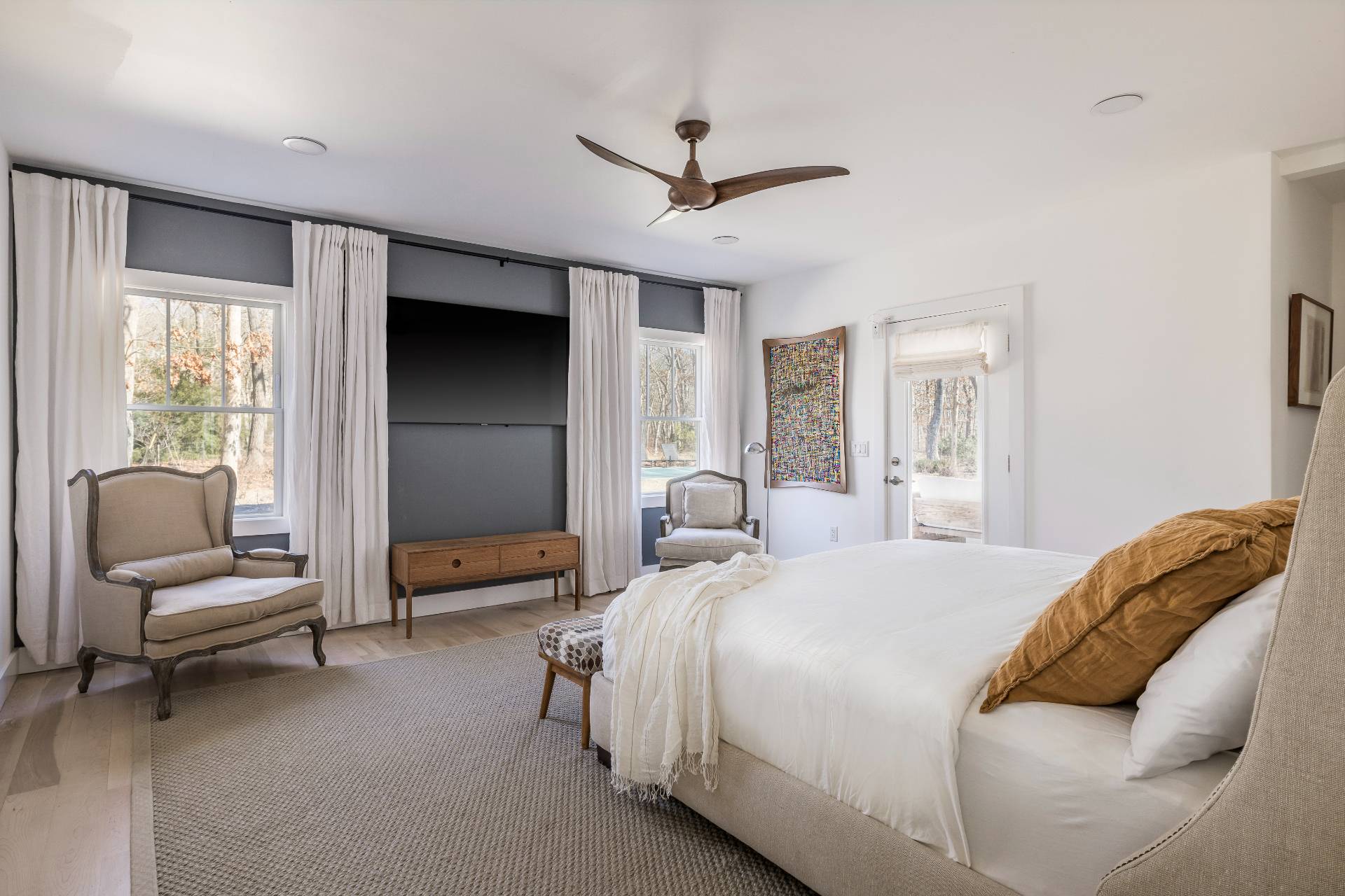 569 Toppings Path Sagaponack, NY 11962 - Photo 10 of 30 a bedroom with a bed and a couch