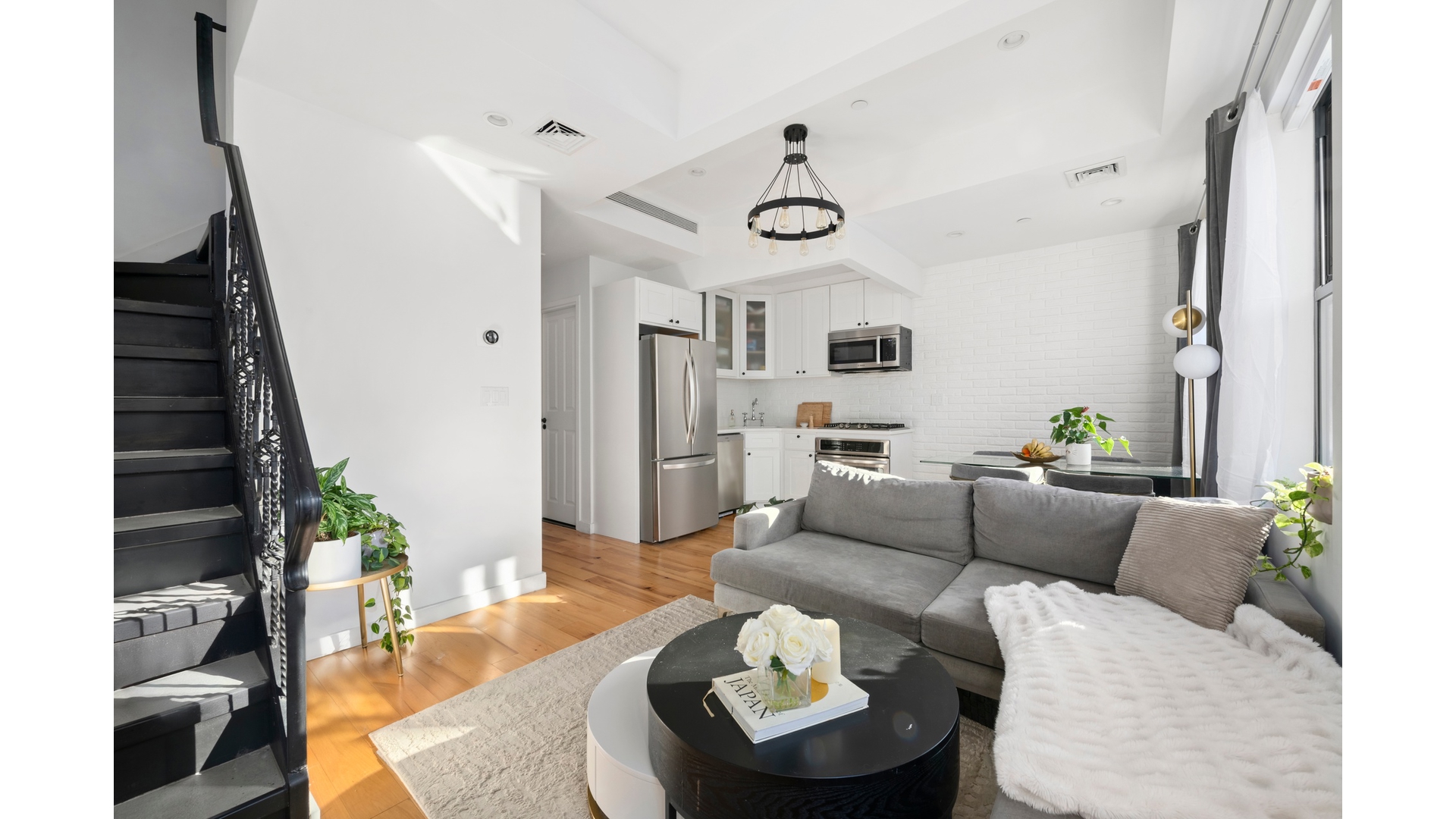 577 Madison Street, Unit 2A Brooklyn, NY 11221 - Photo 6 of 14 a living room with furniture and a rug