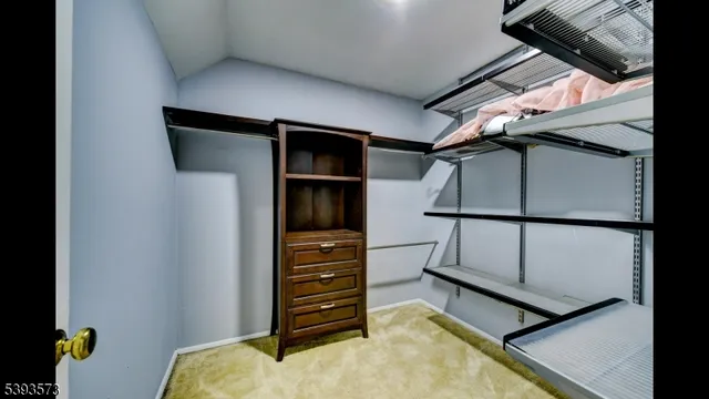 a view of a room with a bed and a window