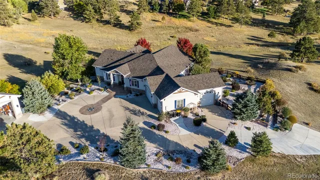 an aerial view of house with yard