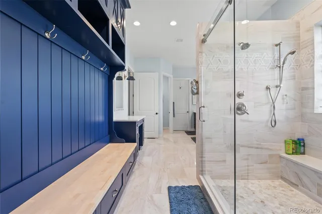 a bathroom with a tub and shower