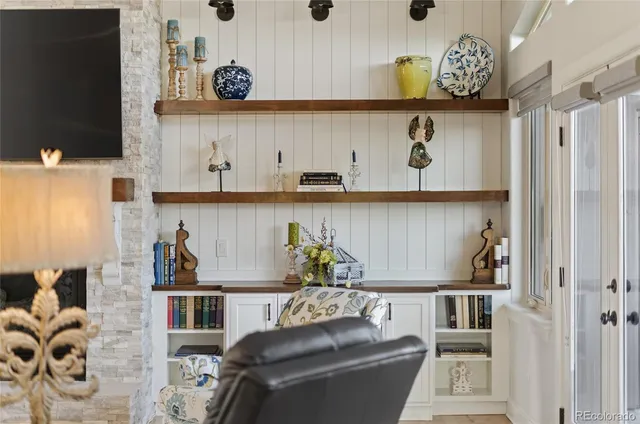 a table with wine bottles and glasses on it
